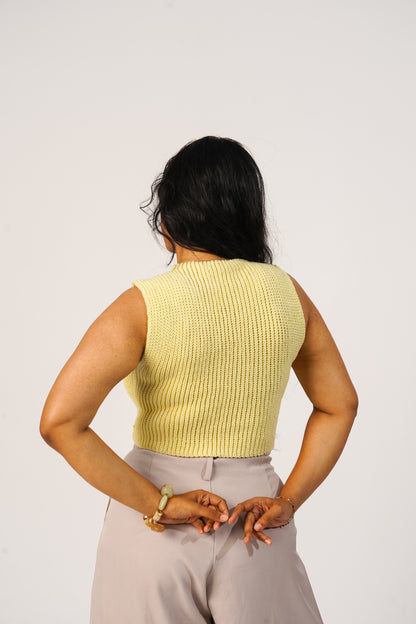 Detailed crochet stitch texture of butter yellow handmade tank
