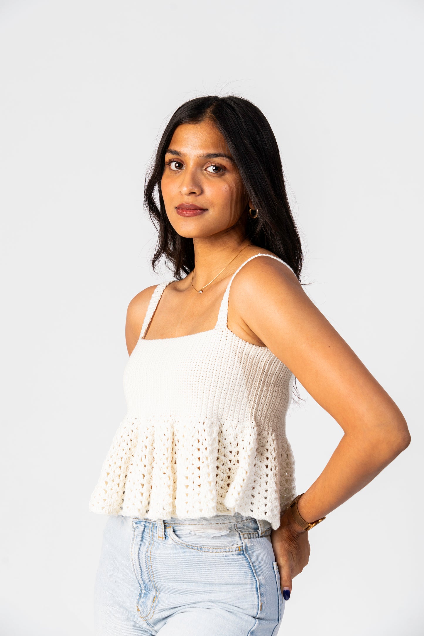 Close-up of crochet texture on the Ivory Souffle Flare Top